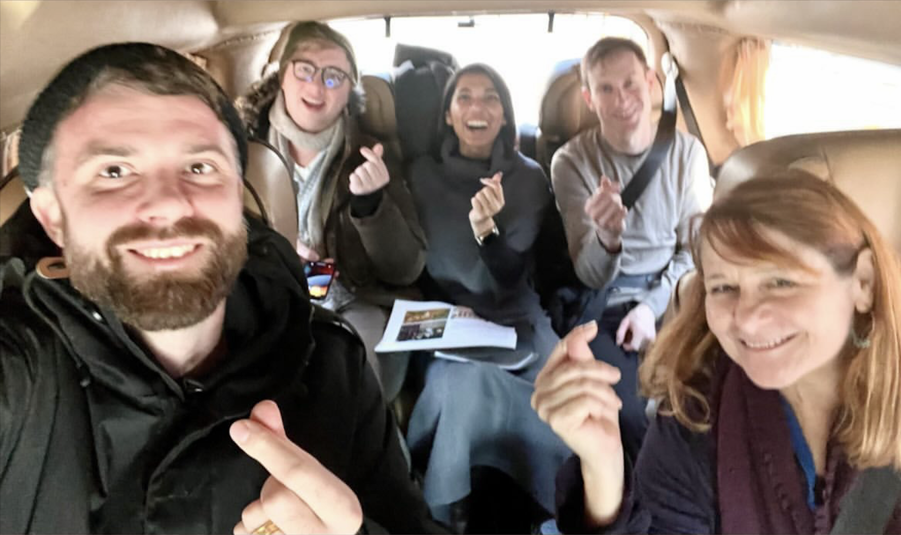 Seoul team, finger hearts in the van